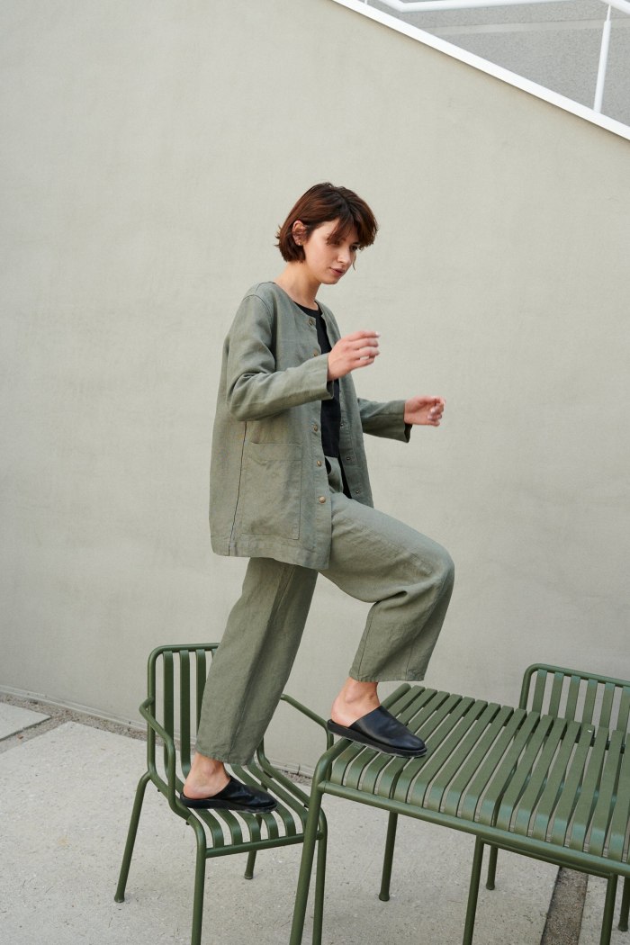A green heavy linen jacket and matching linen trousers outfit
