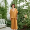Model in an oversized linen top and loose-fitting linen pants