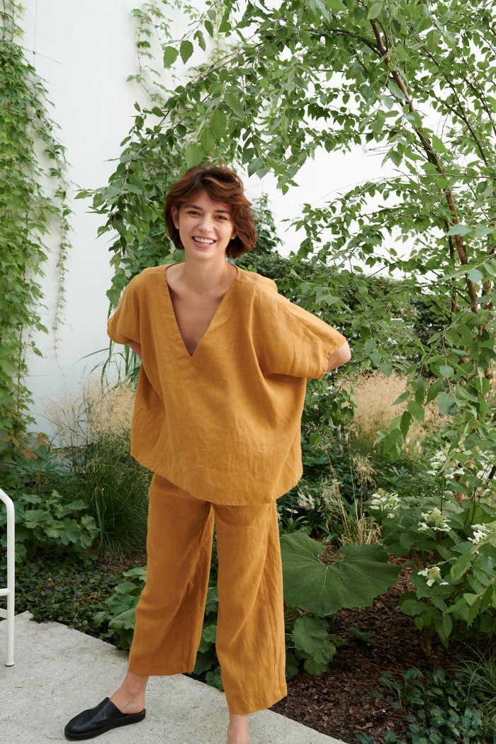 An oversized camel linen top with short sleeves and a V-neckline