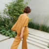 A flowy loose-fitting linen top paired with matching wide-leg linen trousers