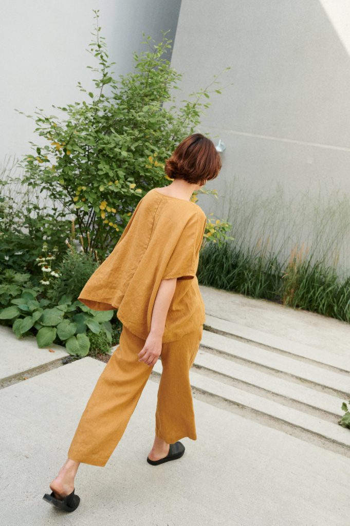 A flowy loose-fitting linen top paired with matching wide-leg linen trousers