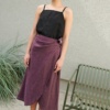 A violet linen skirt and a black linen summer top outfit