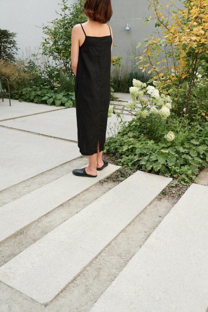 Women is wearing black linen dress