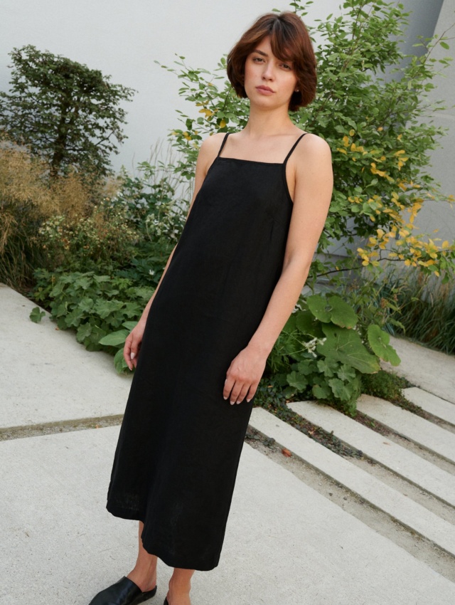 women wearing spaghetti strap black dress