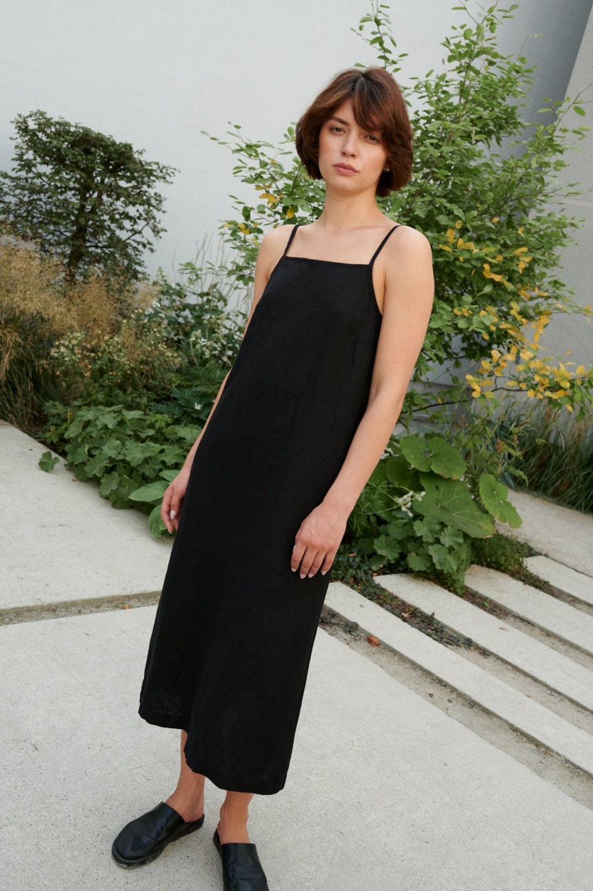 women wearing spaghetti strap black dress