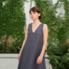 A flowy sleeveless linen dress with a V-neckline