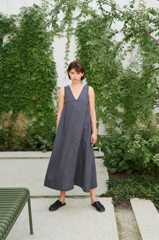 A flowy A-line sleeveless linen dress with a V-neckline
