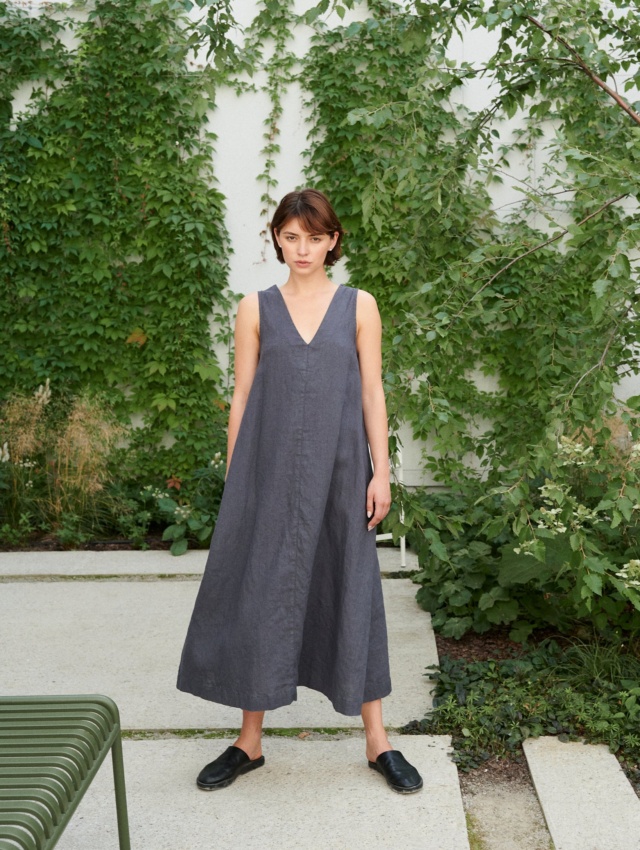 A flowy A-line sleeveless linen dress with a V-neckline