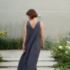 Back of a long sleveless linen dress with a V cut in the back