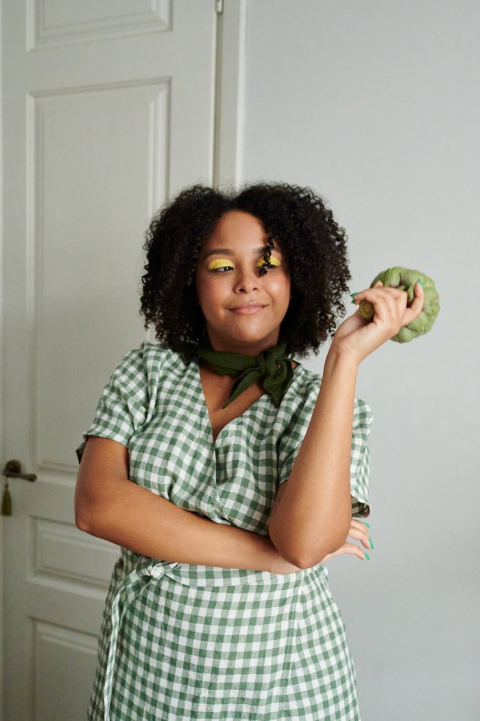 Green gingham linen dress on a woman