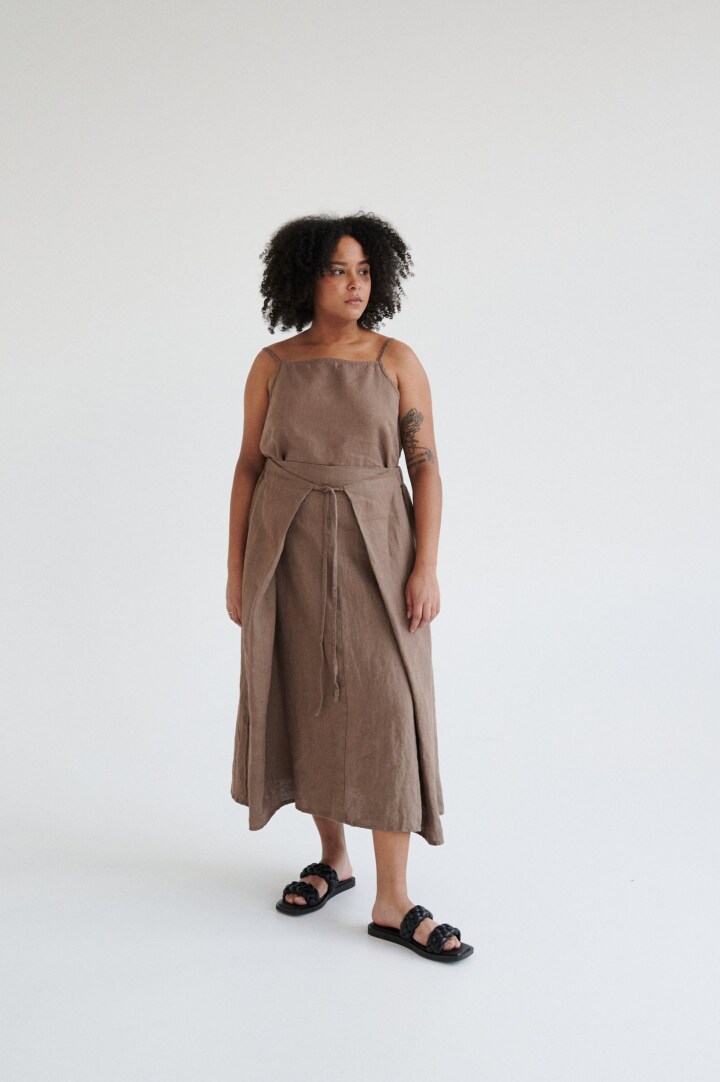 women is wearing brown linen midi skirt