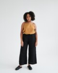 Women wearing black linen culottes