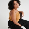 Model wearing linen top in camel color