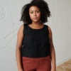 A casual sleeveless linen top with a round neckline