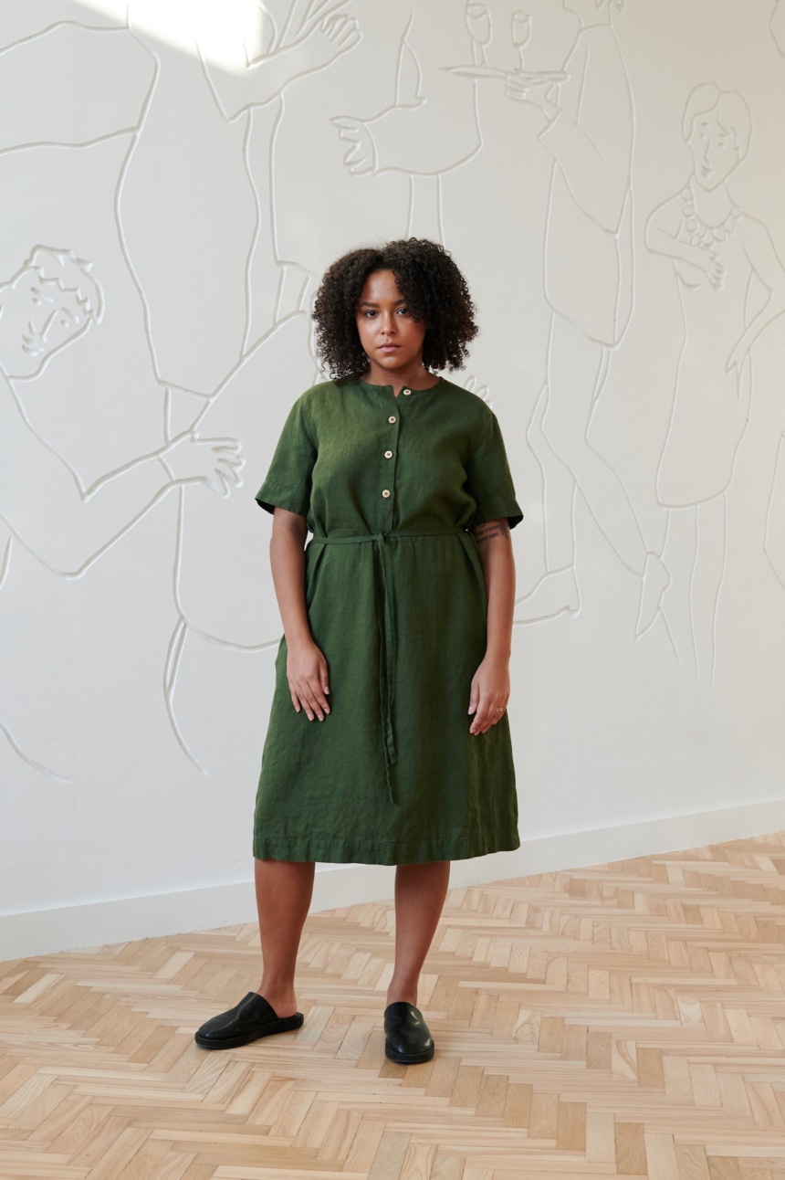 Linenfox model in deep green midi linen dress with a belt and buttons