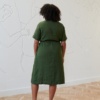 The back of midi linen green dress with a tie belt