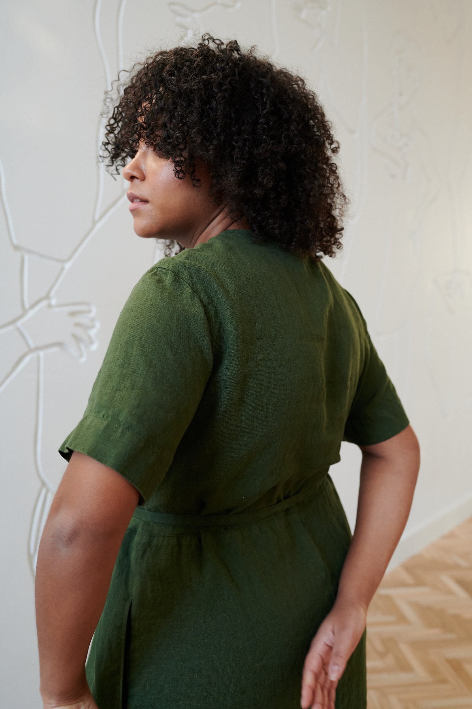 The back of linen short sleeve dress in dark green linen