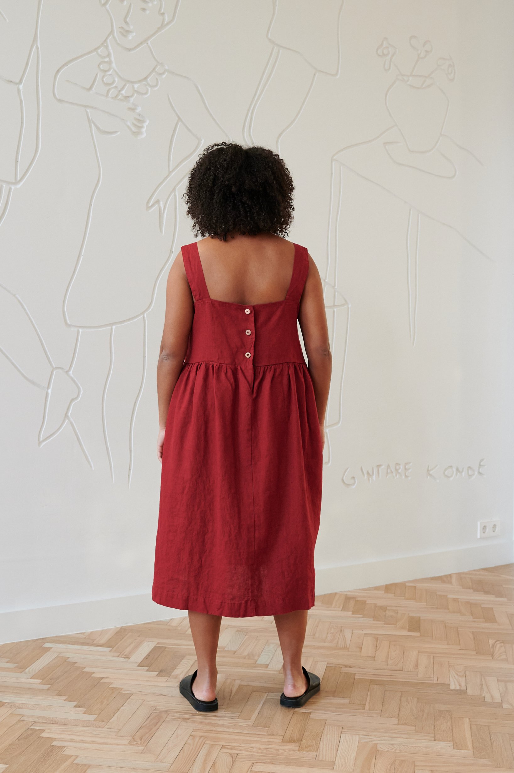 The back of oversized midi linen dress in red
