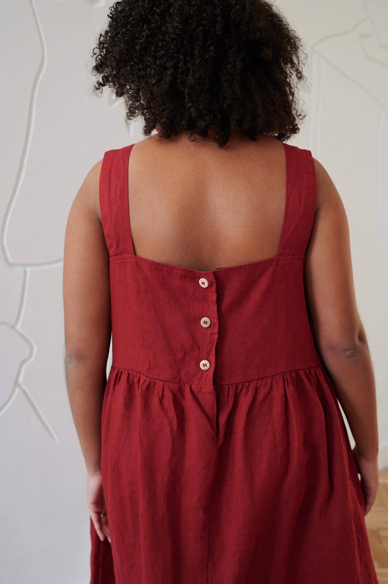 Back buttons of oversized linen summer dress