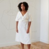 Model wearing white linen dress for summer