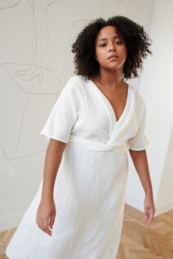 Milky white linen dress with a V-neckline and short sleeves