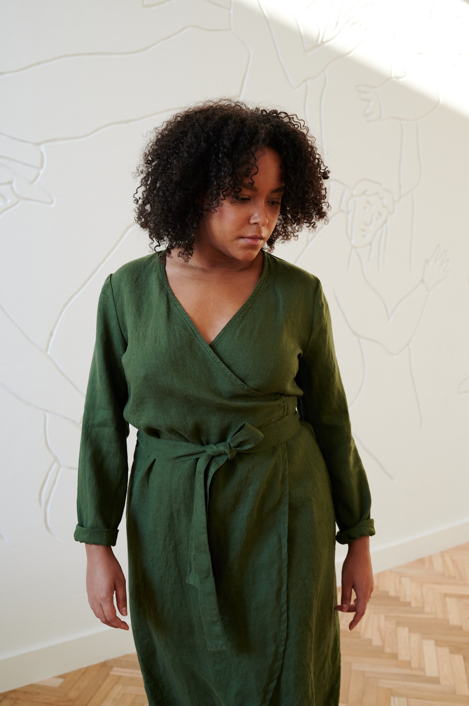 Green wrap linen dress with long sleeves and a V-neck