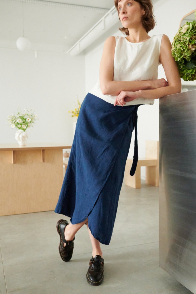 Midi blue wrap linen skirt with a curved hem