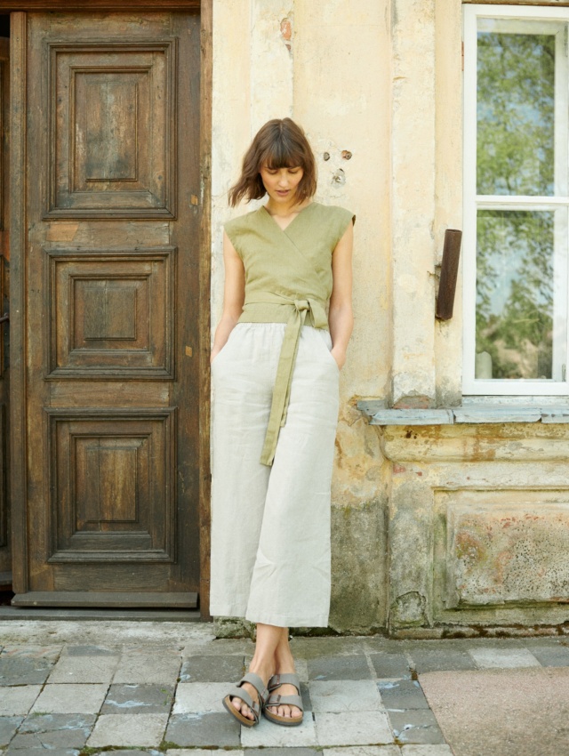 A model wearing natural grey summer linen pants