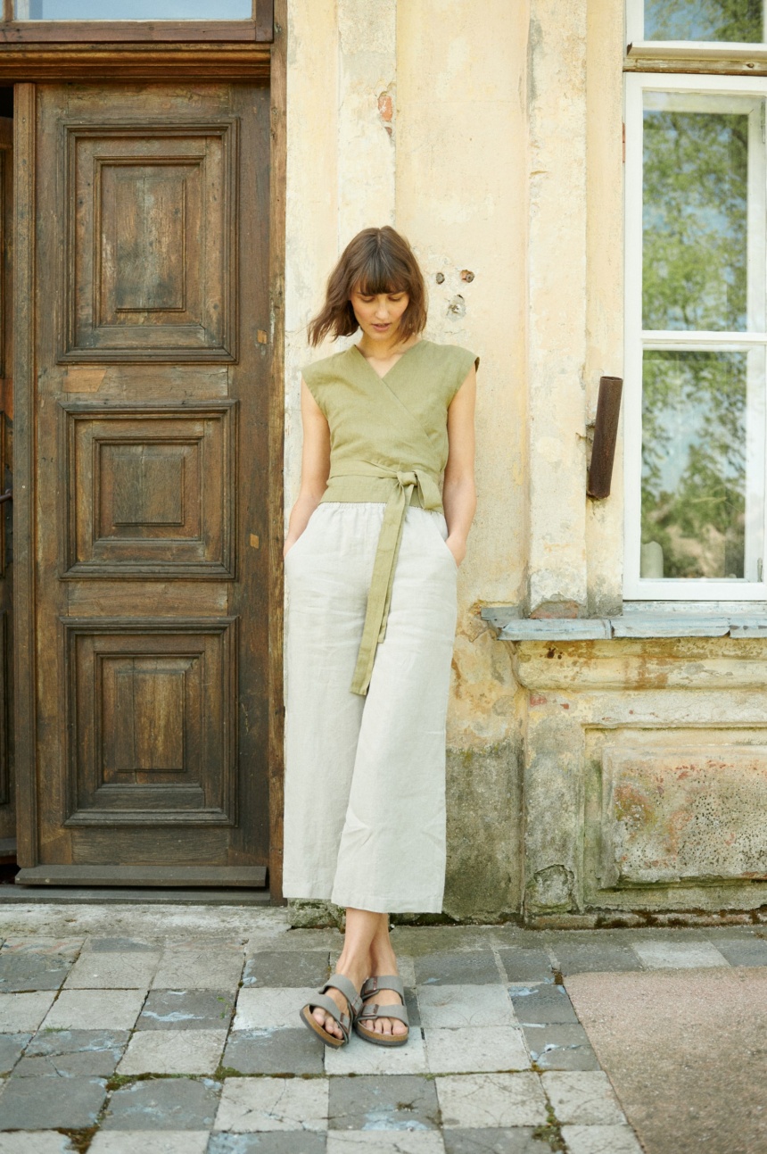 A model wearing natural grey summer linen pants