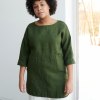 Green linen tunic with white pants combination