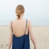 A backless linen summer dress with thin straps