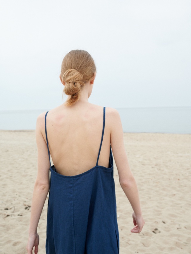 A backless linen summer dress with thin straps