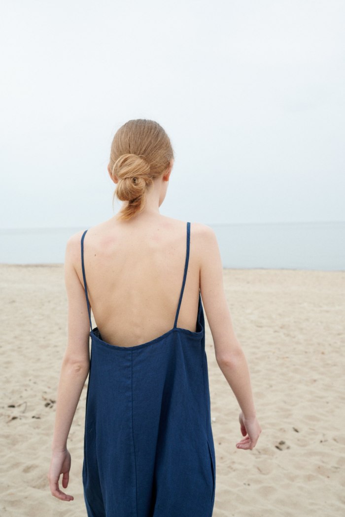 A backless linen summer dress with thin straps