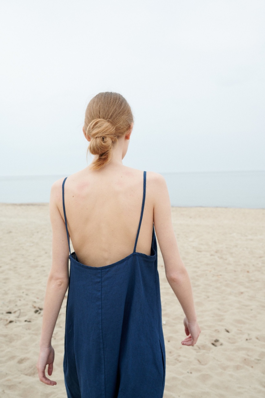 A backless linen summer dress with thin straps