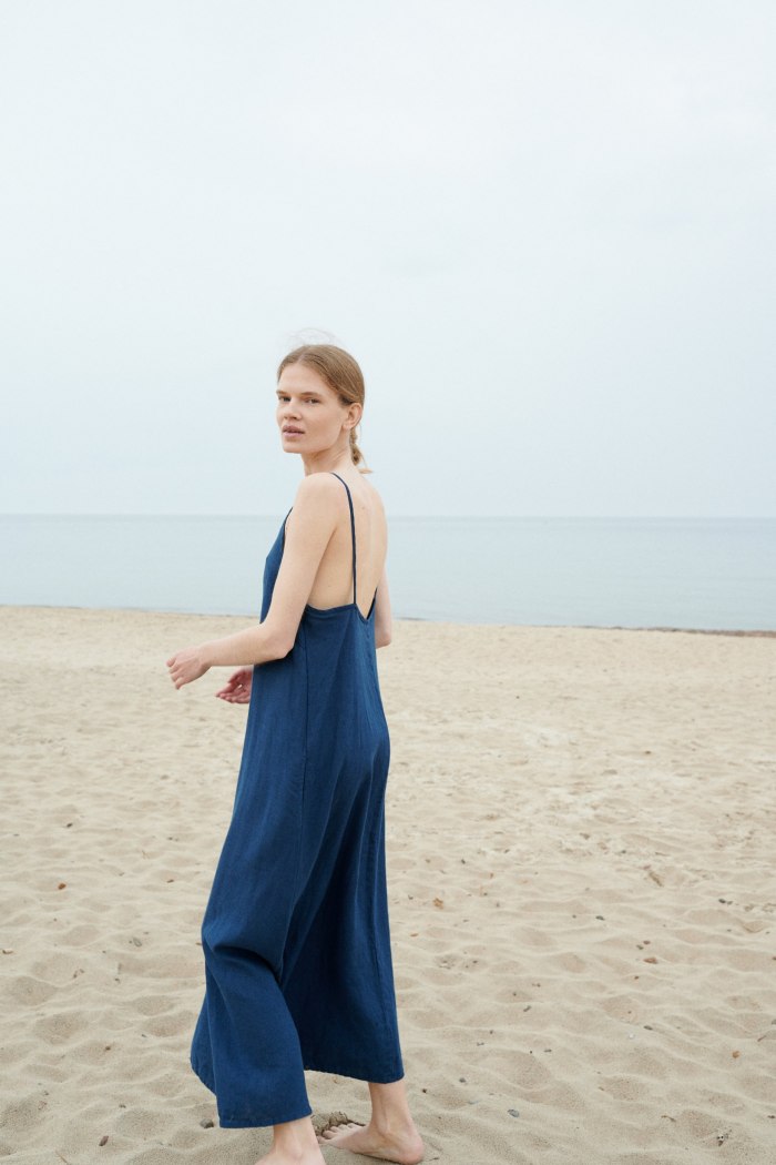 A lightweight linen summer dress with and open back and spaghetti straps