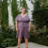 woman wearing violet wrap linen dress