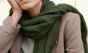Model with heavy linen jacket and green scarf