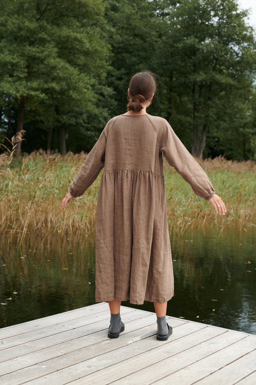 A woman wearing cacao long linen dress