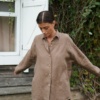 Linenfox model in brown loose-fitting linen shirt