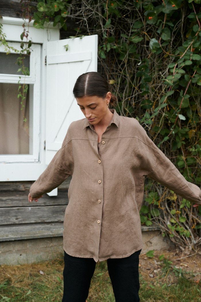 Linenfox model in brown loose-fitting linen shirt