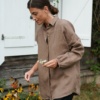A model wearing a brown oversized linen shirt