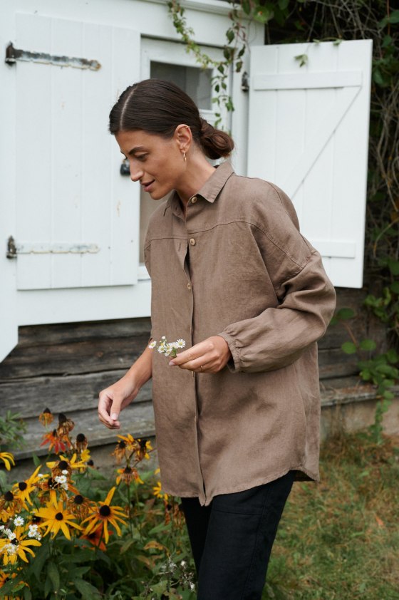 A model wearing a brown oversized linen shirt