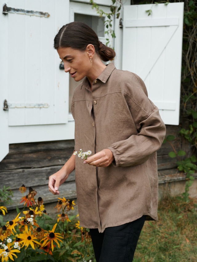 A model wearing a brown oversized linen shirt