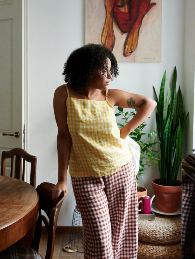 A yellow gingham linen sleeveless top paired with wide-leg terracotta linen pants