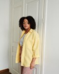 A yellow gingham pattern oversized linen shirt with three-quarter rolled up sleeves