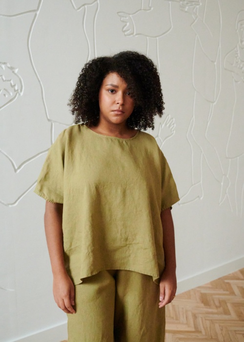 Model wearing linen top in olive