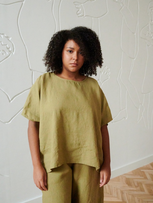 Model wearing linen top in olive