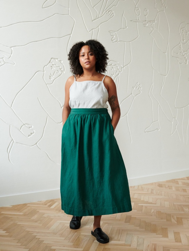 Linen emerald green midi skirt on a model