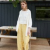A model wearing summer linen trousers in yellow gingham