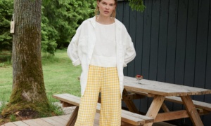 A woman in yellow gingham barrel leg linen trousers